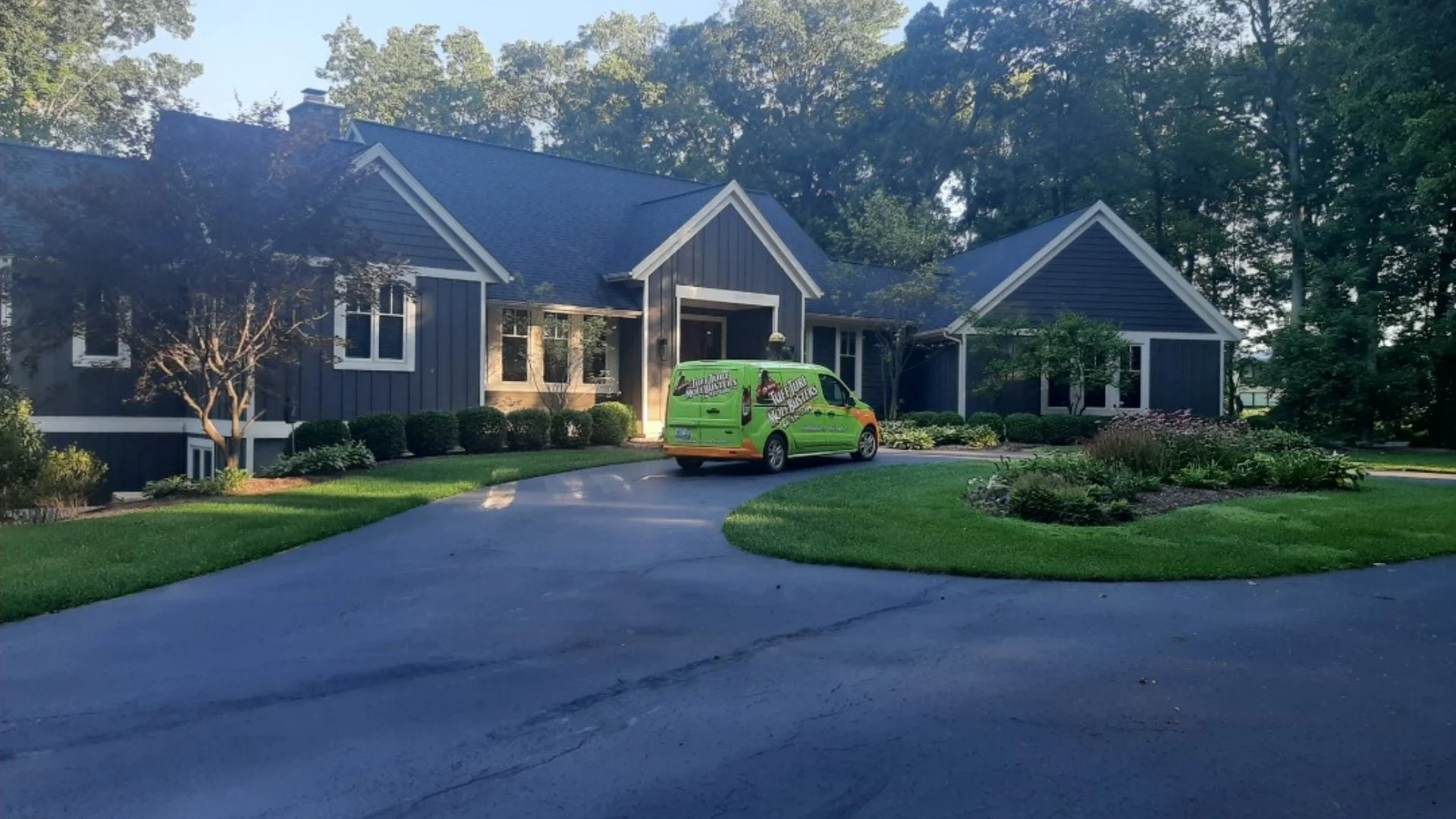 Tuff Turf Van in driveway of a house.