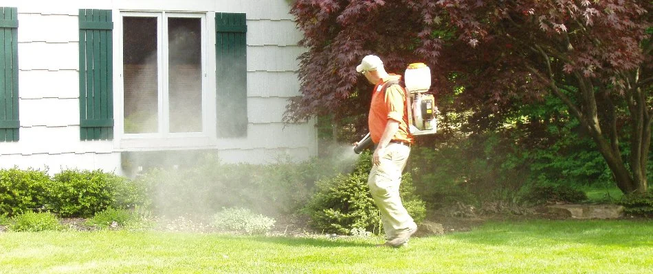 Crew applying a mosquito control treatment on a landscape in Cascade Charter Township, MI.
