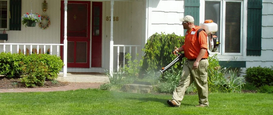 Crew spraying mosquito control treatment on a lawn in Grand Rapids, MI.