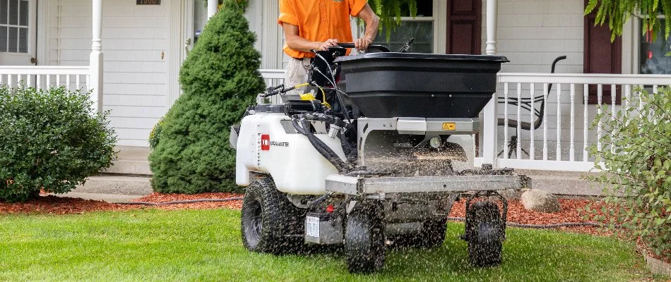Granular fertilizer application on a lawn in Cascade Charter Township, MI.