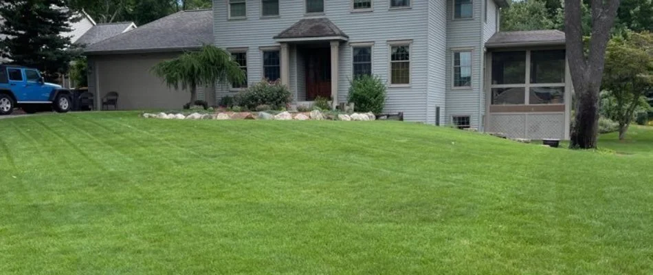 Green lawn by a house in Jamestown Charter Township, MI.
