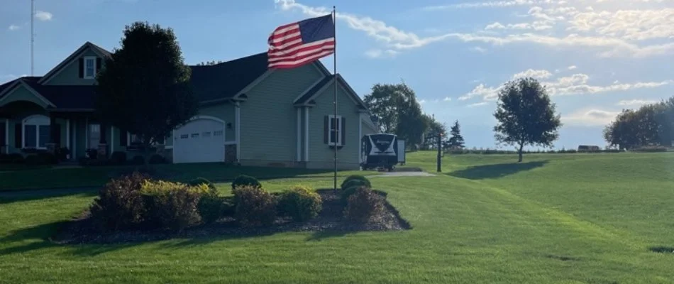 Lawn with American flag in Marne, MI.