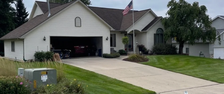 Residential property with American flag in Middleville, MI.