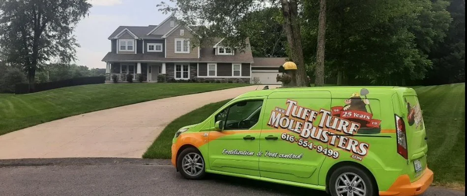 A Tuff Turf van in front of a house in Alto, MI.