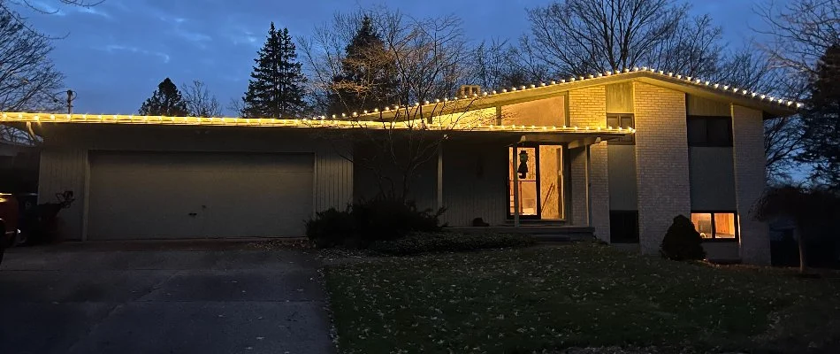 White Christmas lights along a house in Plainwell, MI.