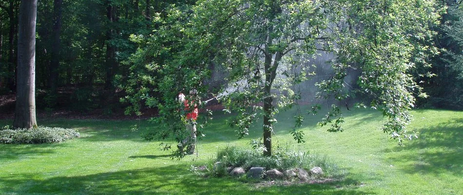 Mosquito treatment being applied to a lawn in Northview, MI.